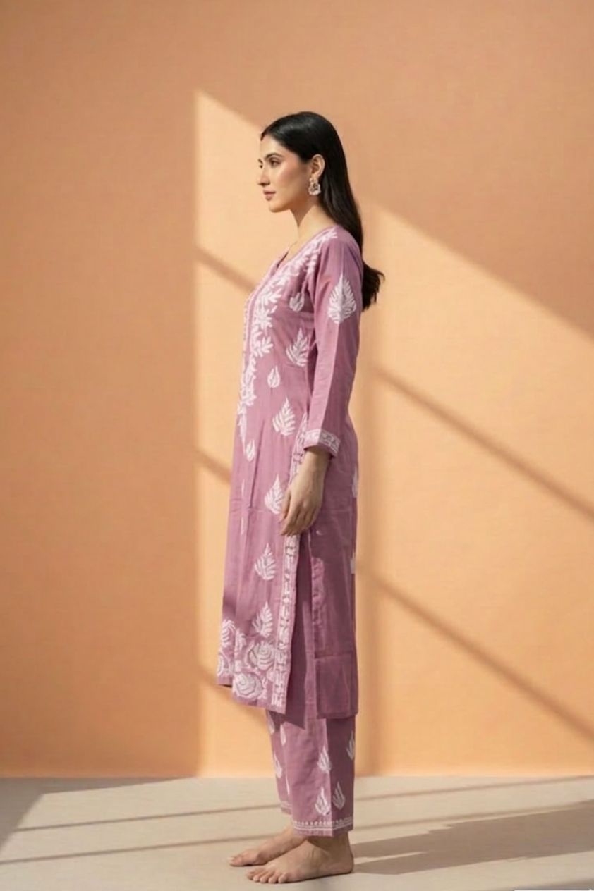 Woman wearing a pink muava chikankari set