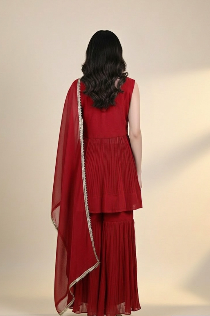 Woman wearing a red embroidered outfit 
