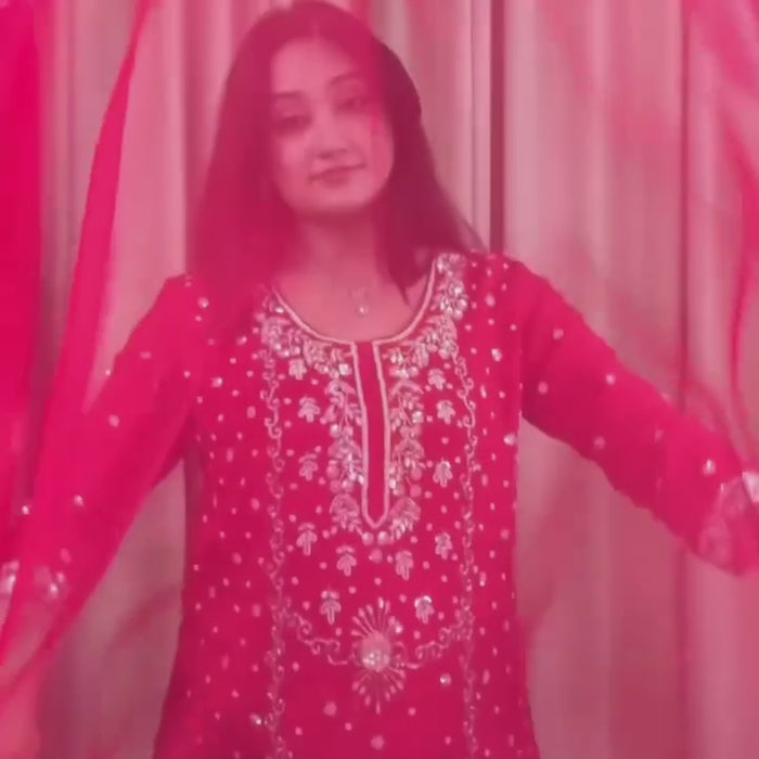 Woman wearing a red chinon sharara set 