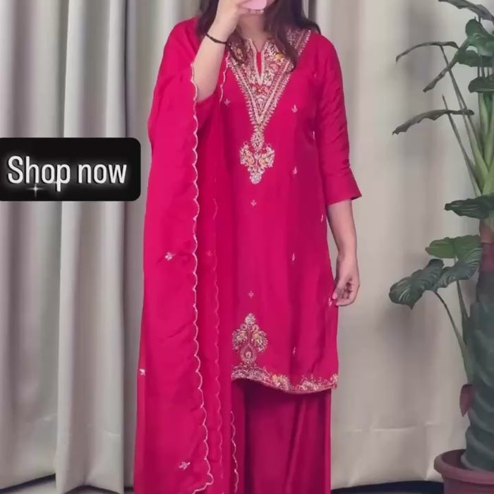 Woman wearing a red embroidered sharara set 