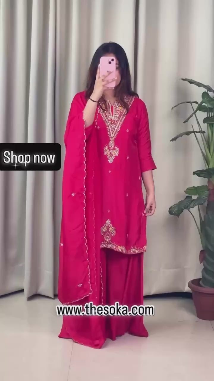 Woman wearing a red embroidered sharara set 