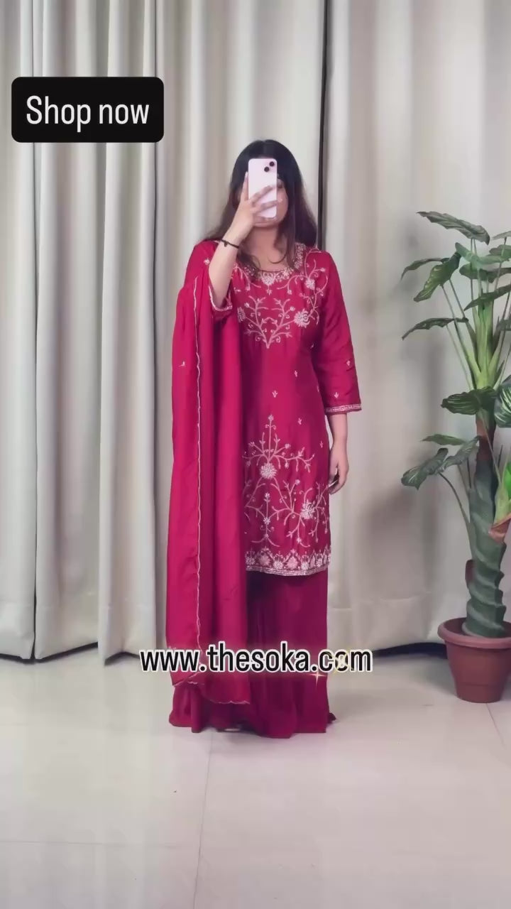 Woman wearing a red embroidered sharara set 