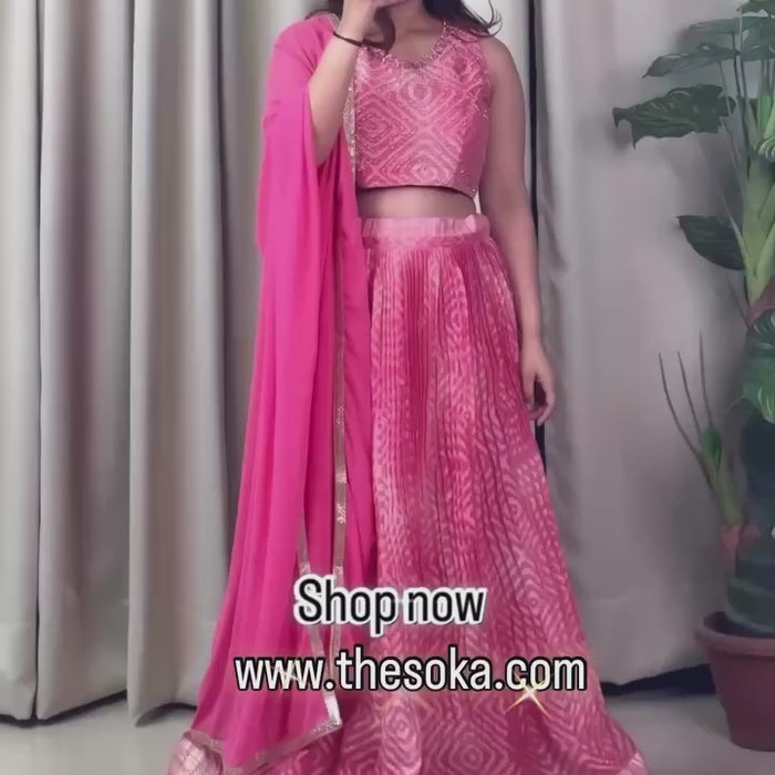 Woman wearing a pink lehenga set 