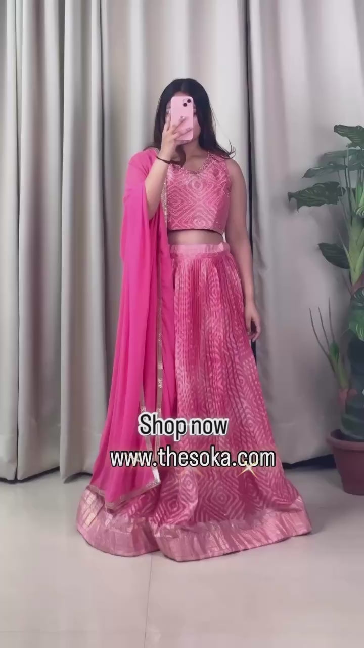 Woman wearing a pink lehenga set 