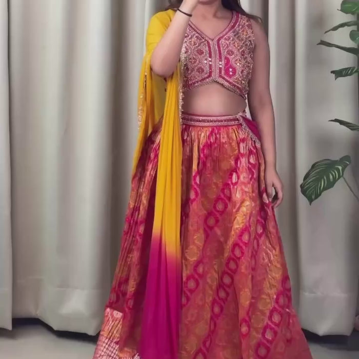 pink blouse and orange skirt lehenga set