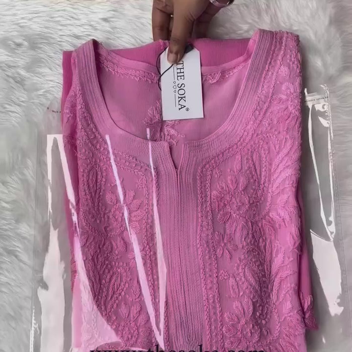 Woman wearing a pink chikankari kurta set 