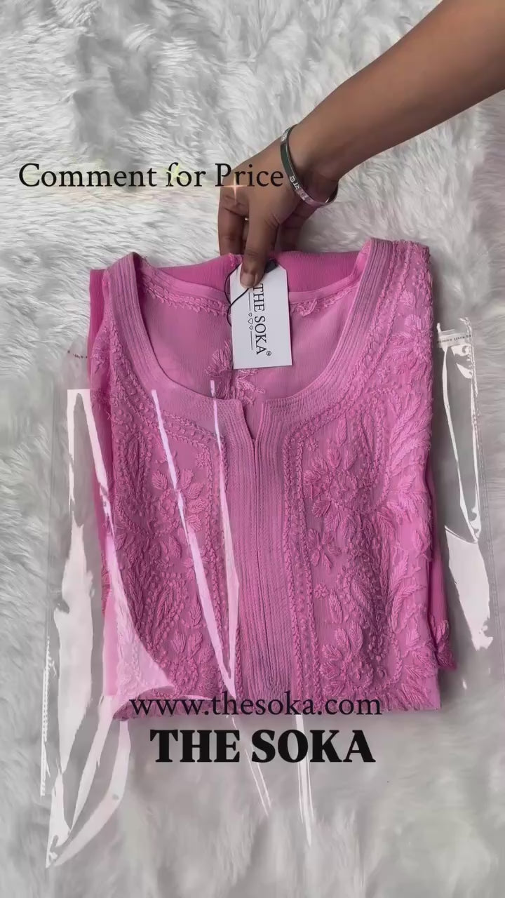 Woman wearing a pink chikankari kurta set 