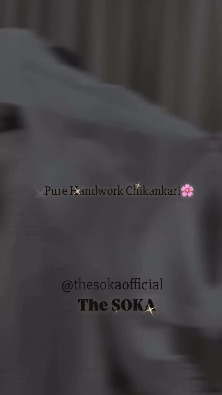Woman wearing a white chikankari kurti set 